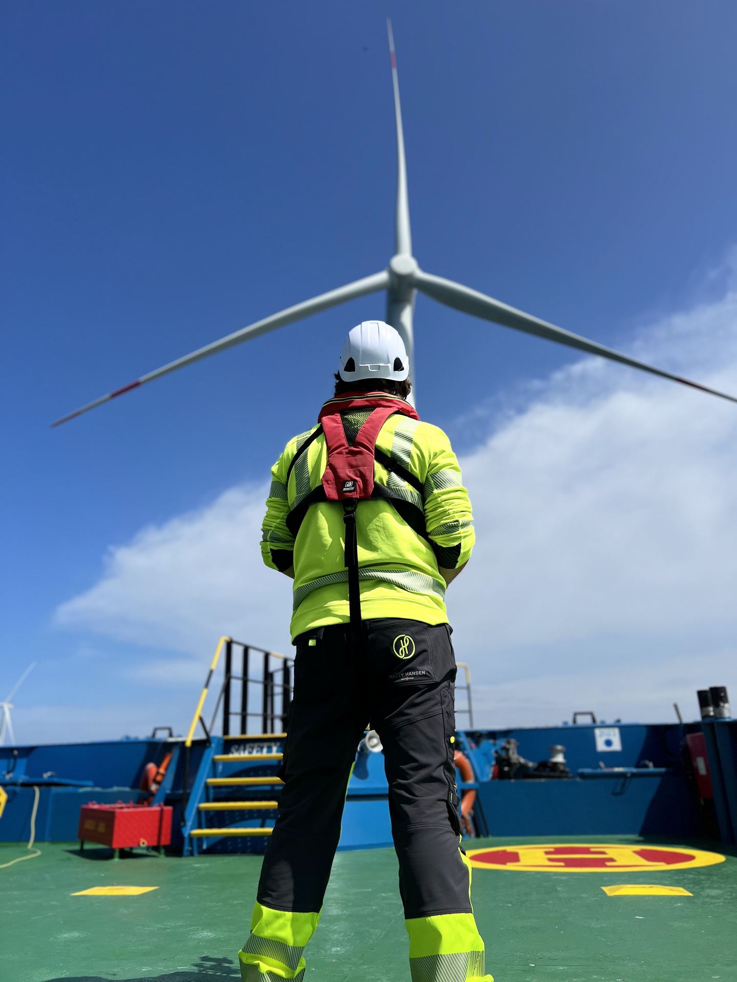 On deck below the turbine, waiting for the right moment.